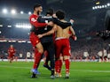 Liverpool players celebrate a goal against Manchester United in January 2020