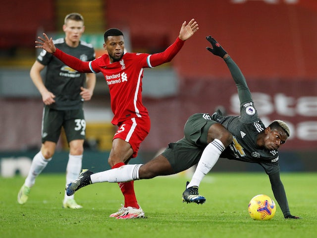 Manchester United's Paul Pogba in action with Liverpool's Georginio Wijnaldum in the Premier League on January 17, 2021
