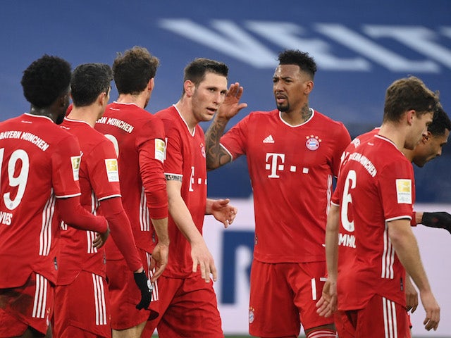 Bayern Munich's Thomas Muller celebrates scoring their first goal with teammates on January 24, 2021