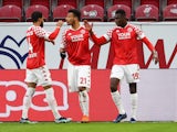 Mainz 05's Moussa Niakhate celebrates scoring their first goal with teammates in January 23, 2021