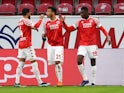 Mainz 05's Moussa Niakhate celebrates scoring their first goal with teammates in January 23, 2021