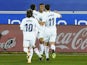 Real Madrid's Casemiro celebrates scoring their first goal with Real Madrid's Eder Militao, Marco Asensio and Luka Modric on January 23, 2021
