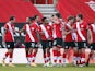 Southampton players celebrate scoring against Arsenal in the FA Cup on January 23, 2021