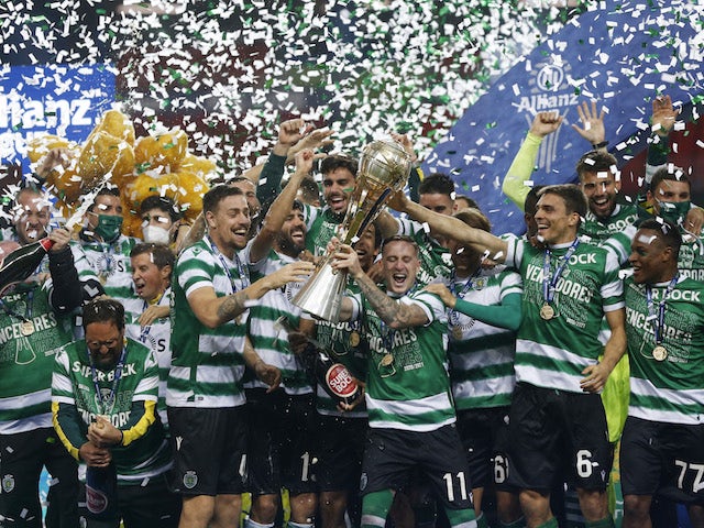 Sporting Lisbon players celebrate winning the Taca da Liga with the trophy on January 23, 2021