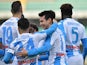 Napoli's Hirving Lozano celebrates scoring their first goal with teammates on January 24, 2021