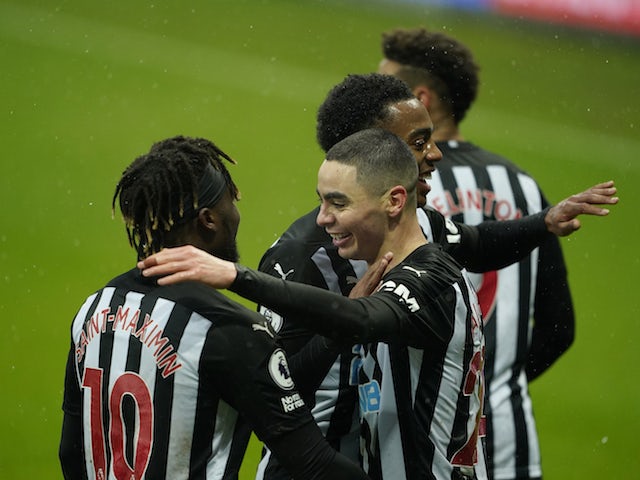 Newcastle United's Miguel Almiron celebrates scoring their third goal with teammate Allan Saint-Maximin on February 6, 2021