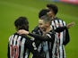 Newcastle United's Miguel Almiron celebrates scoring their third goal with teammate Allan Saint-Maximin on February 6, 2021