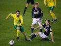 Norwich City's Mario Vrancic in action with Millwall's Ben Thompson in the Championship on February 2, 2021