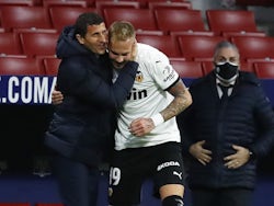 Valencia boss Javi Gracia celebrates with Uros Racic in January 2021