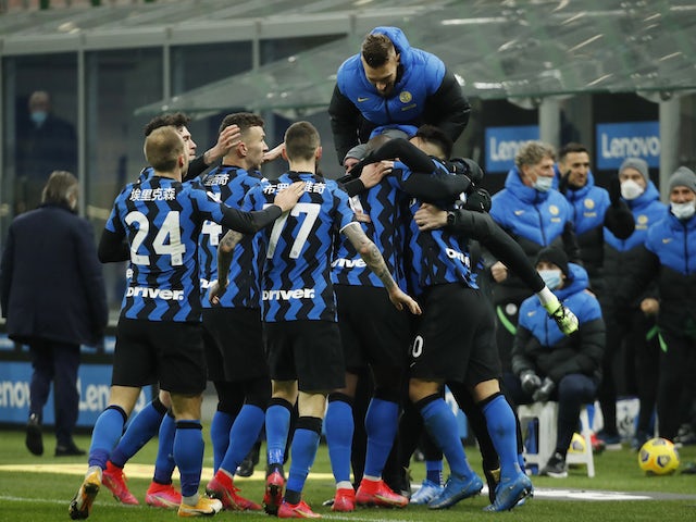 Inter Milan's Lautaro Martinez celebrates scoring their third goal with teammates on February 14, 2021