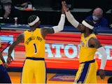 Los Angeles Lakers guard Kentavious Caldwell-Pope and guard Wesley Matthews celebrate in overtime against the Oklahoma City Thunder on February 9, 2021