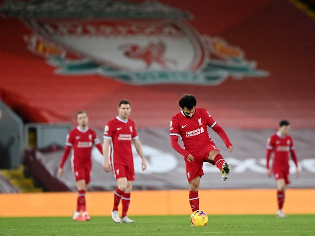 Liverpool players look dejected after conceding to Manchester City in February 2021