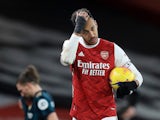 Arsenal's Pierre-Emerick Aubameyang celebrates with the match ball after scoring a hat-trick on February 14, 2021