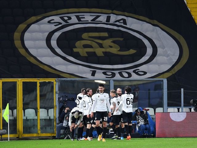 Spezia's Giulio Maggiore celebrates scoring their first goal with teammates on February 13, 2021