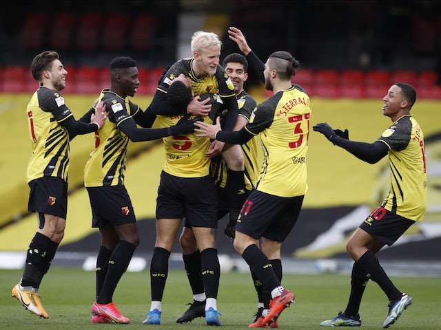 Watford's Will Hughes celebrates scoring their third goal with teammates on February 13, 2021
