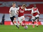 Arsenal's Martin Odegaard in action with Manchester City's Oleksandr Zinchenko in the Premier League on February 21, 2021