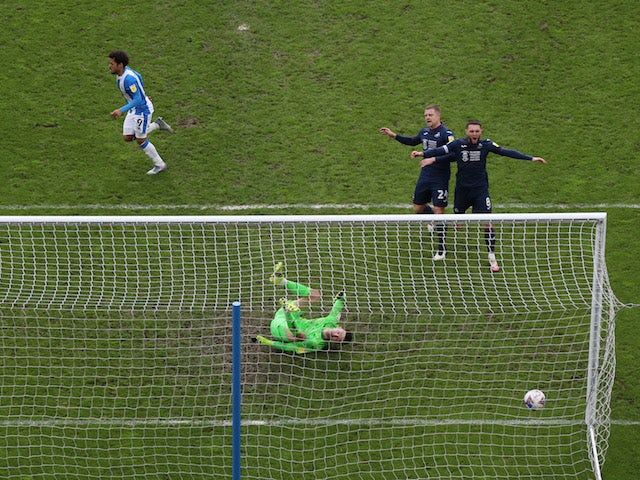 Huddersfield Town's Duane Holmes scores their third goal against Swansea on February 20, 2021
