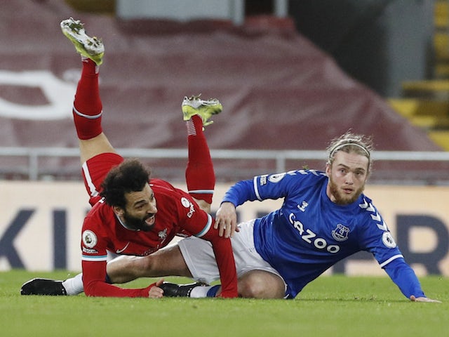Everton's Tom Davies in action with Liverpool's Mohamed Salah in the Premier League on February 20, 2021