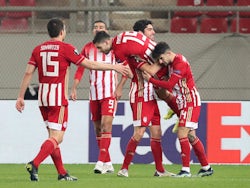 Olympiacos' Giorgos Masouras celebrates scoring their fourth goal with teammates in the Europa League on February 18, 2021