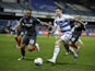 Queens Park Rangers' Lyndon Dykes in action with Brentford's Winston Reid in the Championship on February 17, 2021