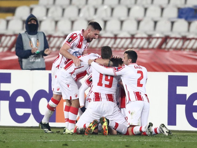 Red Star Belgrade Radovan Pankov celebrates scoring their second goal with teammates in the Europa League on February 18, 2021