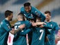 AC Milan's Theo Hernandez celebrates scoring their second goal with Rafael Leao and teammates in the Europa League on February 18, 2021