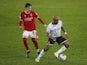 Swansea City's Andre Ayew in action with Nottingham Forest's James Garner in the Championship on February 17, 2021