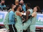 Charlotte Hornets players embrace Terry Rozier after his game-winning shot against the Golden State Warriors on February 20, 2021