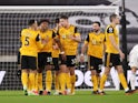 Wolverhampton Wanderers celebrate after Leeds United's Illan Meslier scores an own goal in the Premier League on February 19, 2021