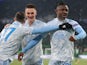 Dinamo Zagreb's Iyayi Atiemwen celebrates scoring their third goal with teammates in the Europa League on February 18, 2021