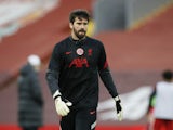 Alisson Becker warms up for Liverpool on February 20, 2021
