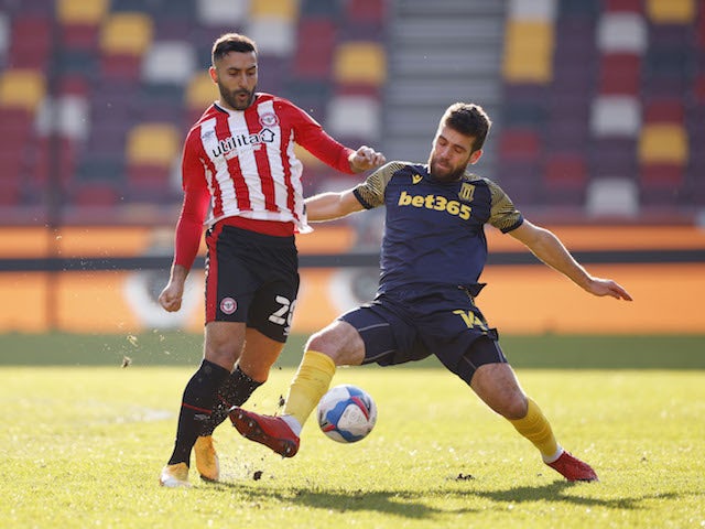 Brentford's Saman Ghoddos in action with Stoke's Tommy Smith on February 27, 2021