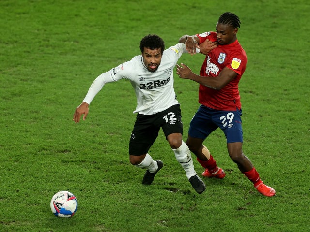 Derby County's Nathan Byrne in action with Huddersfield Town's Aaron Rowe on February 23, 2021