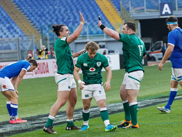 Ireland's James Lowe celebrates with teammates after scoring a try against Italy in the Six Nations on February 27, 2021
