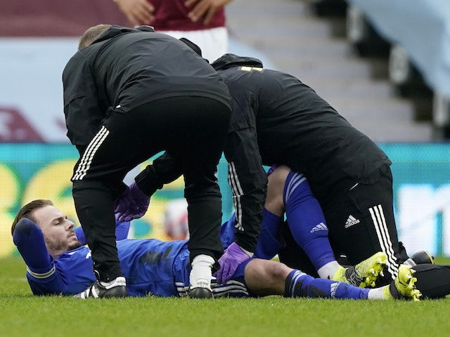 Leicester City's James Maddison receives medical attention after sustaining an injury in February 2021