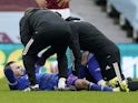 Leicester City's James Maddison receives medical attention after sustaining an injury in February 2021