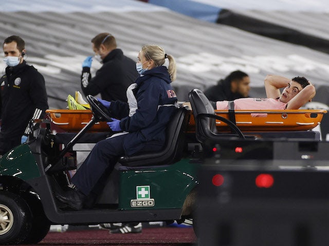 Sheffield United's John Egan is stretchered off after sustaining an injury in February 2021