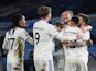 Leeds United's Stuart Dallas celebrates scoring their second goal with Luke Ayling and teammates on February 23, 2021
