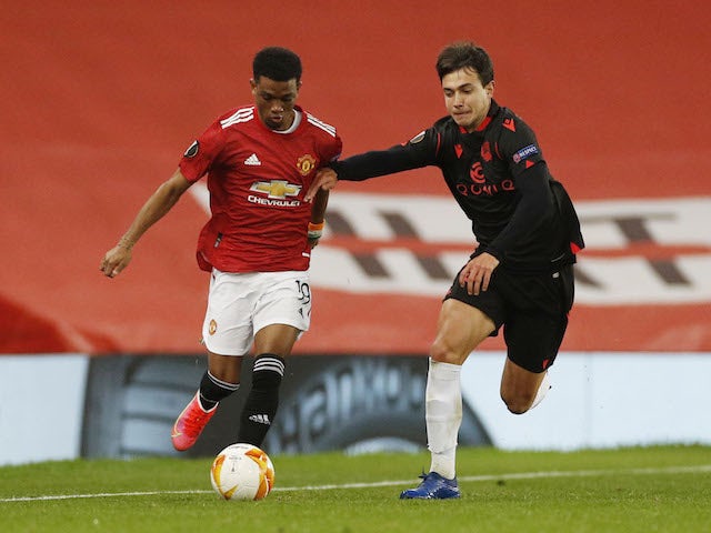 Manchester United's Amad Diallo in action with Real Sociedad's Ander Guevara in the Europa League on February 25, 2021