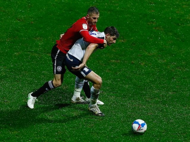 Preston North End's Ched Evans in action with Queens Park Rangers' Dominic Ball in the Championship on February 24, 2021