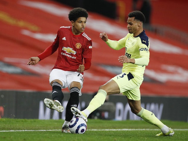 Manchester United's Shola Shoretire in action with Newcastle United's Jacob Murphy in the Premier League on February 21, 2021