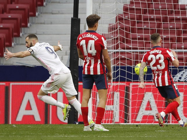 Real Madrid's Karim Benzema celebrates scoring against Atletico Madrid in La Liga on March 7, 2021