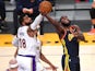 Los Angeles Lakers forward Markieff Morris defends a shot by Golden State Warriors forward Eric Paschall on March 1, 2021