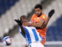 Cardiff City's Curtis Nelson in action with Huddersfield Town's Yaya Sanogo in the Championship on March 5, 2021