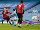 Manchester United's Luke Shaw scores against Manchester City in the Premier League on March 7, 2021
