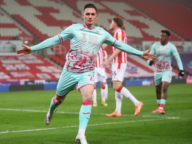 Swansea City's Connor Roberts celebrates scoring against Stoke City in the Championship on March 3, 2021