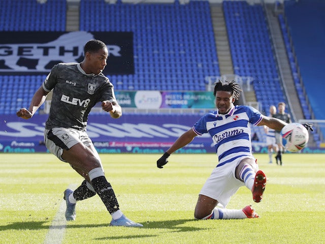 Sheffield Wednesday's Osaze Urhoghide in action with Reading's Omar Richards on March 6, 2021