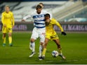 Queens Park Rangers' Charlie Austin in action with Wycombe Wanderers' Curtis Thompson in the Championship on March 9, 2021