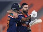 India's Hardik Pandya and Virat Kohli walk off after their innings on March 20, 2021