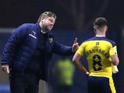 Oxford United's manager Karl Robinson pictured with Cameron Brannagan on March 2, 2021